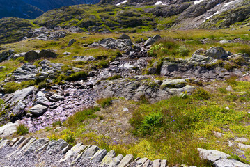 Glacier river of Stone Glacier at region of Swiss mountain pass Sustenpass in the Swiss Alps on a sunny summer day. Photo taken July 13th, 2022, Susten Pass, Switzerland.