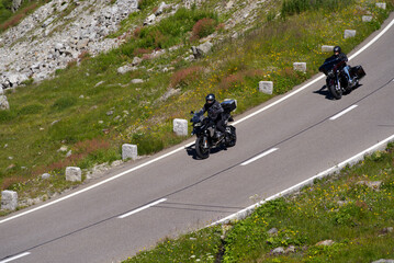 Motorcycles on the way down at Swiss mountain pass Susten destination Innertkirchen, Canton Bern, on a sunny summer day. Photo taken July 13th, 2022, Susten Pass, Switzerland.
