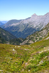 Fototapeta premium Beautiful scenic view of mountain panorama with mountain pass road at Swiss mountain pass Sustenpass on a sunny summer day. Photo taken July 13th, 2022, Susten Pass, Switzerland.