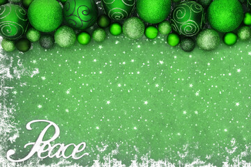 Christmas peace sign background border with green sparkling glitter tree bauble decorations on...
