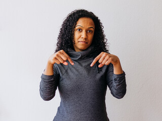 A young black African girl showing down 