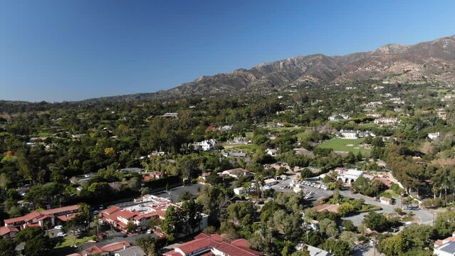 Montecito homes and downtown aerial with mountain backdrop