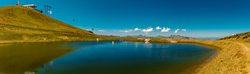 High resolution panorama with reflections at the famous Schattberg mountain, Saalbach-Hinterglemm, Salzburg, Austria