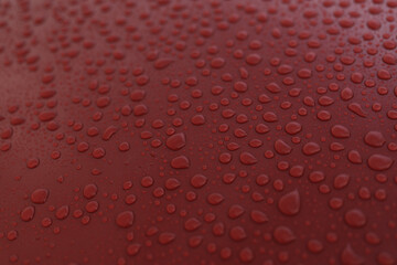 Wet red car with hydrophobic coating