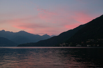 duck swims in sunset on the lake como, italy