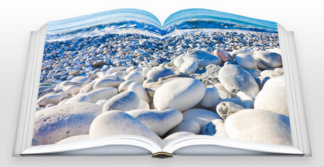 White and gray stones softly rounded and washed from sea water - Real opened book concept