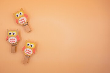 Cute owl paper clips in orange background