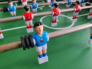 Arcade table soccer with tools for playing for office and home games.