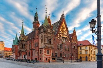 Multicolored traditional historical houses and City Hall on Market square at sunset, Old Town of Wroclaw, Poland