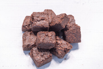 Ten Chocolate Brownie Squares just out the ovan and on a board ready to serve.