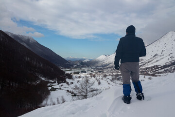 Fototapeta na wymiar hiker with the letino valley with snow