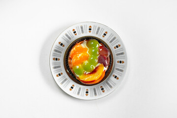 Cupcake with fruits on plate white with background