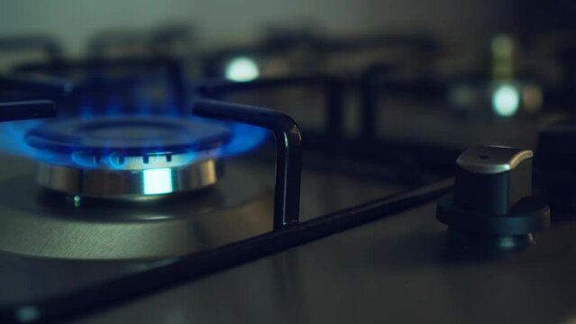 Kitchen gas stove fire inflaming. Blue flame switch on. Embargoes and economic sanctions. Global crisis