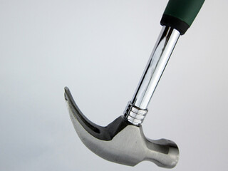    green hammer on white background     