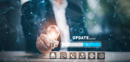 Man hold light bulb and Update Software Computer Program Upgrade Business Technology Internet,...
