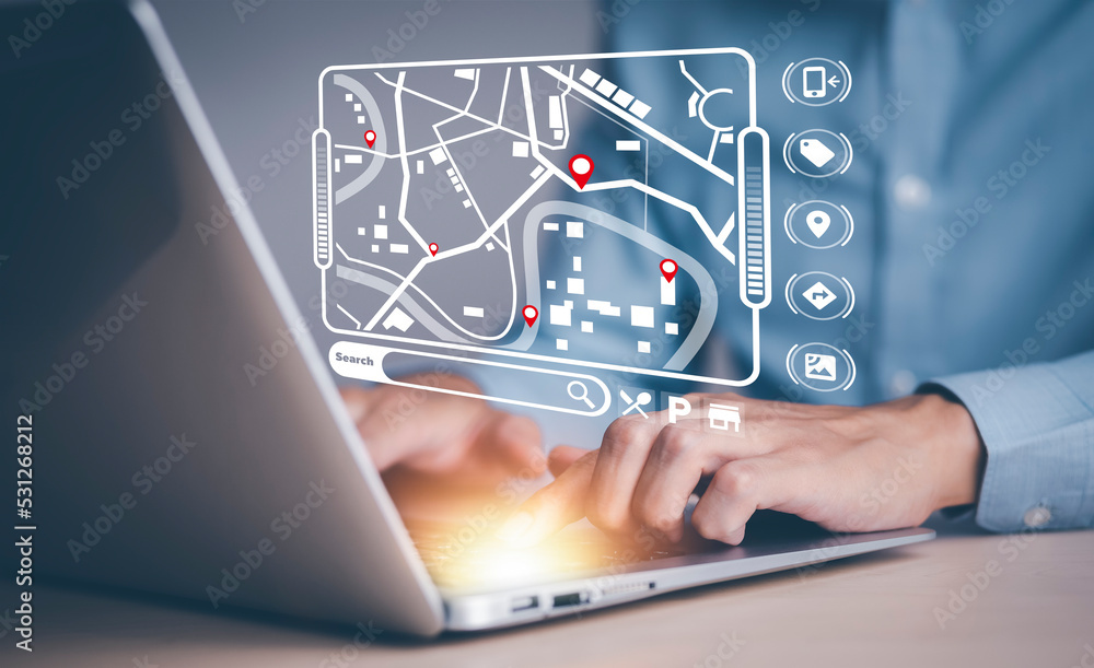 Fototapete man using laptop with virtual world and model map with location point , gps app, icon travel maps an