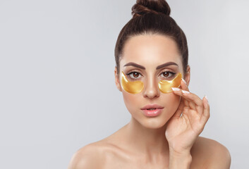 Beauty Model Girl Face With Healthy Fresh Skin. Woman With Under Eye Collagen Gold Pads.  Skin Care...