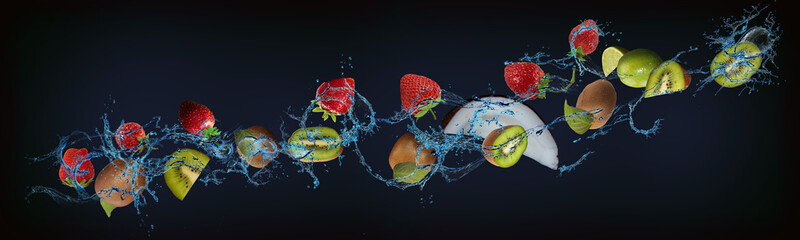 Panorama with fruits in water - juicy kiwi, coconut, strawberries, lime sweet dessert for the...