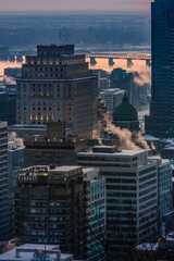 View on the Montreal skyline at sunrise on a cold winter day from the Mount Royal (Quebec, Canada)