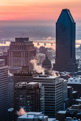 View on the Montreal skyline at sunrise on a cold winter day from the Mount Royal (Quebec, Canada)