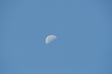 Half Moon in a Blue Sky