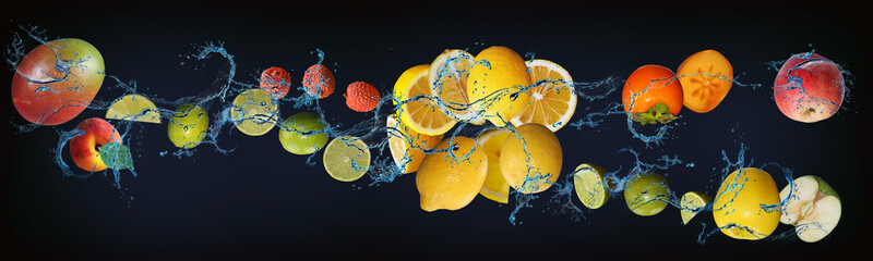 Panorama with fruits in water - juicy apple, lime, persimmon, lemon, lychee, peach, mango sweet...