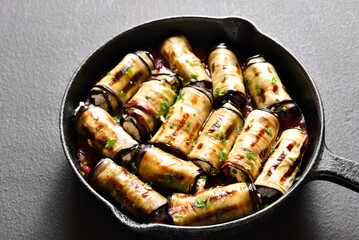 Eggplant (aubergine) rolls with cheese and greens