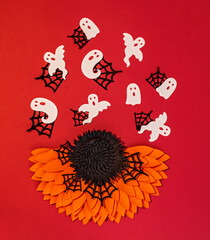 creative halloween background with paper flowers and ghosts