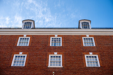 Fototapeta na wymiar Traditional brick architecture of buildings in London, the UK's grand capital.