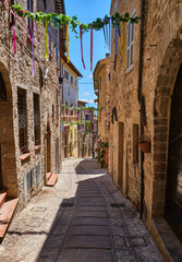 Fototapeta na wymiar street in the medieval village of spello, umbria, italy