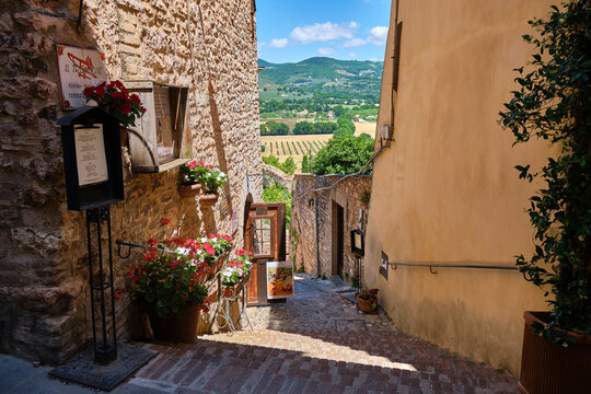 street in the medieval village of spello, umbria, italy