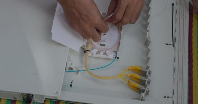 Fusion of Fiber Optics Cable Internet signal splicing and wire connection using equipment, optical line welding machine Optic fiber soldering ISP engineer