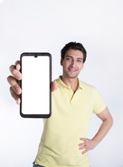 Fototapeta na wymiar Handsome smiling man showing smartphone with white screen. Mobile Application and advertising concept