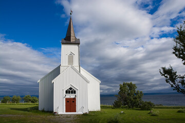 Fototapeta na wymiar Kistrand church on the shore of Porsangerfjorden, Norway