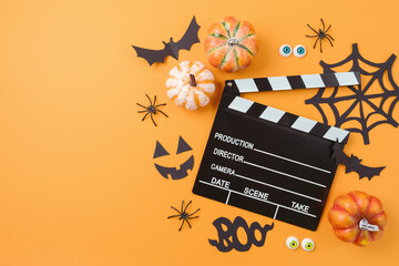 Horror movie night and Halloween party concept with   pumpkin, decorations and movie clapper board...