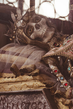 gemstone encrusted relic skull of a woman in a church