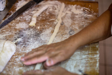 hands kneading dough