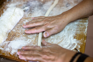 hands kneading dough