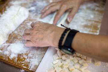 person kneading dough