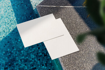 Clean minimal A5 flyer mockup on pool side background with leaves