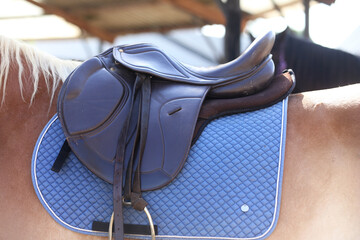 Close up of a sport horse saddle. Quality classical leather saddle