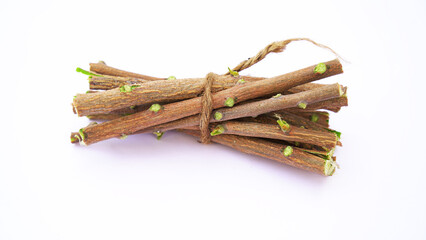 Medicinal neem twigs. Herbal neem leaves and branch over white background. Azadirachta indica - A branch of neem tree leaves. Natural Medicine.