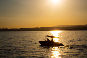 Boat in the sunset on Lake Garda