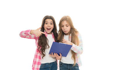 After examination. Excited children checking up examination result in clipboard. Little girls holding examination pad. Taking writing test and examination
