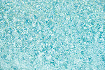 Fototapeta na wymiar blue color background of swimming pool water with ripples. concept of summer