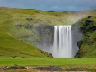 Skógafoss waterfall on the Skógá River in the south of Iceland at the cliff marking the former coastline.
