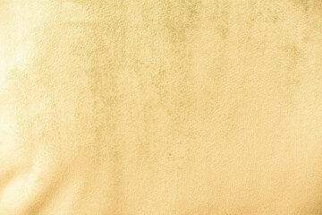 Yellow velvet fabric surface from above. velvet texture yellow color background. expensive luxury fabric, material, wallpaper.