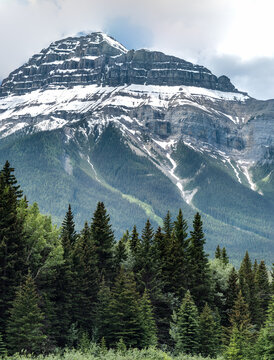 Snow Covered Granite Mountains In The Canadian Rockies