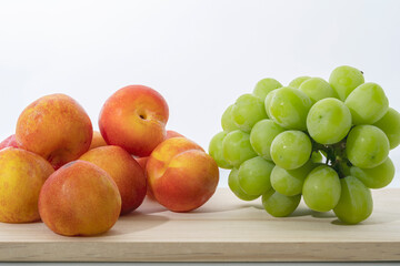Fresh plums and sweet grapes