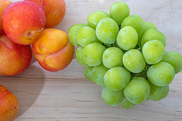 Fresh plums and sweet grapes